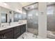 Bathroom featuring a double sink vanity, with a seamless glass shower, and luxurious finishes at 12716 W Mclellan Rd, Glendale, AZ 85307