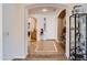 Inviting foyer with tiled flooring, arched doorways, and views into the adjacent living spaces at 13594 W Port Royale Ln, Surprise, AZ 85379