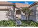 Close-up of a house entrance, showcasing desert landscaping and architectural details at 13594 W Port Royale Ln, Surprise, AZ 85379