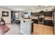 Open concept kitchen featuring stainless steel appliances, granite countertops and adjacent dining area at 13594 W Port Royale Ln, Surprise, AZ 85379