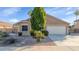 Charming single-story home with a well-manicured front yard and two-car garage at 1363 N Mckenna Ln, Gilbert, AZ 85233