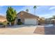 Lovely single-story house with a 2-car garage, mature landscaping, and palm trees in a desirable neighborhood at 1363 N Mckenna Ln, Gilbert, AZ 85233