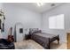 Minimalist bedroom with a full-length mirror and sleek black bed frame at 14547 W Evans Dr, Surprise, AZ 85379