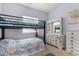 Comfortable bedroom with bunk beds and classic dresser at 14547 W Evans Dr, Surprise, AZ 85379