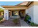 Welcoming front porch with seating and decorative plants, enhancing curb appeal at 14547 W Evans Dr, Surprise, AZ 85379