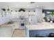 Functional kitchen with white appliances and a breakfast bar area at 14547 W Evans Dr, Surprise, AZ 85379