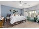 Serene main bedroom with a cozy sitting area and ample natural light at 14547 W Evans Dr, Surprise, AZ 85379