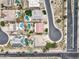 Bird's-eye view of a residential neighborhood showcasing homes with pools, well-maintained yards, and tree-lined streets at 14674 W Windsor Ave, Goodyear, AZ 85395