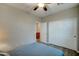 Neutral bedroom with a double closet and view to another room at 14674 W Windsor Ave, Goodyear, AZ 85395