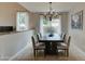 Bright dining room with ample natural light and space for a large table at 14674 W Windsor Ave, Goodyear, AZ 85395