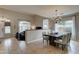 Elegant dining room featuring a modern chandelier and access to the living area at 14674 W Windsor Ave, Goodyear, AZ 85395