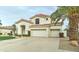 Beautiful two-story home boasting a red tile roof, desert landscaping, and a spacious three-car garage at 14674 W Windsor Ave, Goodyear, AZ 85395