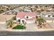 Stunning two-story home featuring a red tile roof, well-manicured lawn, and an attached three-car garage at 14674 W Windsor Ave, Goodyear, AZ 85395