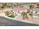 Beautiful two-story home showcasing a red tile roof, desert landscaping, and an attached three-car garage at 14674 W Windsor Ave, Goodyear, AZ 85395