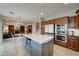 Spacious kitchen featuring stainless appliances, a large center island, and ample cabinet space at 14674 W Windsor Ave, Goodyear, AZ 85395