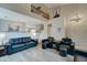 Bright living room with high ceilings, large windows, hardwood floors, and stairs to a second level at 14674 W Windsor Ave, Goodyear, AZ 85395