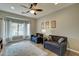 Inviting living room with bright light, modern furniture, and hardwood floors at 14674 W Windsor Ave, Goodyear, AZ 85395