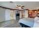 This main bedroom features barn door access to the bathroom and a custom built in office at 14674 W Windsor Ave, Goodyear, AZ 85395