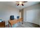 Home office with wood desk and sliding closet, ready for work at 14674 W Windsor Ave, Goodyear, AZ 85395