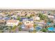 Expansive aerial view of a home featuring a pool, patio, and solar panels in a residential neighborhood at 15652 N 175Th Ct, Surprise, AZ 85388