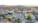 An aerial view of the home and neighborhood showing desert landscaping, pools, and solar panels at 15652 N 175Th Ct, Surprise, AZ 85388