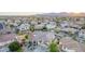 Neighborhood aerial showcasing homes with desert landscaping, pools, and mountain views at 15652 N 175Th Ct, Surprise, AZ 85388