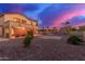 A spacious backyard with a pebble landscape, covered patios and pool at 15652 N 175Th Ct, Surprise, AZ 85388