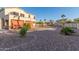 A large backyard features desert landscaping, patio sun shade and swimming pool at 15652 N 175Th Ct, Surprise, AZ 85388