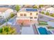 An aerial view of the home's backyard featuring a pool, patio, and desert landscaping at 15652 N 175Th Ct, Surprise, AZ 85388