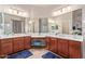 Bathroom features a double vanity and a large mirror at 15652 N 175Th Ct, Surprise, AZ 85388