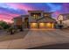 Stunning two-story home featuring a three-car garage and stone accents at 15652 N 175Th Ct, Surprise, AZ 85388