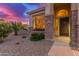 Close-up showcasing the home's stone accents, large window, and well-maintained landscaping at 15652 N 175Th Ct, Surprise, AZ 85388