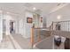 Bright and airy hallway features a staircase, carpeted floors and stylish arches at 15652 N 175Th Ct, Surprise, AZ 85388