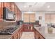 Gourmet kitchen featuring stainless steel appliances and granite countertops at 15652 N 175Th Ct, Surprise, AZ 85388