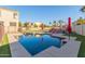 An inviting backyard pool with lush greenery, creating a private oasis for outdoor enjoyment at 15652 N 175Th Ct, Surprise, AZ 85388