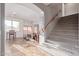 Welcoming staircase with carpeted steps and a view of the front living room at 15652 N 175Th Ct, Surprise, AZ 85388