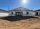 New construction home in progress with frame completed; backyard area ready for landscaping and personalization at 15770 W Cheryl Dr, Waddell, AZ 85355