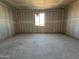 Unfinished bedroom showcasing a blank canvas for customization and a well-placed window for natural light at 15770 W Cheryl Dr, Waddell, AZ 85355