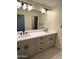 Bathroom vanity features double sinks, drawers, and contemporary fixtures at 1637 W Green Tree Dr, San Tan Valley, AZ 85144