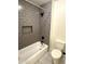 Bathroom features shower and tub with neutral subway tile at 1637 W Green Tree Dr, San Tan Valley, AZ 85144