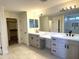 Bathroom vanity features double sinks and contemporary fixtures, with a connecting shower at 1637 W Green Tree Dr, San Tan Valley, AZ 85144