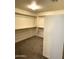 Spacious walk-in closet with built-in shelving and ample storage space at 1637 W Green Tree Dr, San Tan Valley, AZ 85144