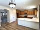 Updated kitchen featuring wood cabinets, subway tile backsplash, and stainless steel appliances at 1637 W Green Tree Dr, San Tan Valley, AZ 85144