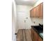 Functional laundry room with tile flooring, cabinetry, and utility sink at 1637 W Green Tree Dr, San Tan Valley, AZ 85144