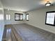 Bright and airy living room with new carpet, neutral paint, and modern light fixtures at 1637 W Green Tree Dr, San Tan Valley, AZ 85144