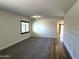 Spacious living room featuring neutral paint, carpet, and wainscoting at 1637 W Green Tree Dr, San Tan Valley, AZ 85144