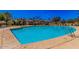 Sparkling community pool with lounge chairs, providing a refreshing and relaxing amenity for residents to enjoy at 1664 E Bridgeport Pkwy, Gilbert, AZ 85295