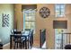 Well-lit dining room boasts a wooden table and chairs, complemented by a large window with decorative blinds at 1664 E Bridgeport Pkwy, Gilbert, AZ 85295