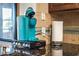 Kitchen with a teal Keurig, granite countertop, and decorative backsplash near a window at 1664 E Bridgeport Pkwy, Gilbert, AZ 85295