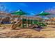 Community playground featuring colorful play structures, slides, and sun shades, perfect for outdoor fun and recreation at 1664 E Bridgeport Pkwy, Gilbert, AZ 85295